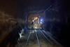 Team of geomicrobiologists walking to a sampling site at the end of an inactive tunnel in a South African gold mine Credit Emil Ruff