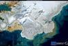 Satellite image shows a large sediment discharge in the Arctic Sea, off the coast of Svalbard, caused by the rapid melting of snow and ice.