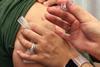 795px-A_woman_receives_the_seasonal_influenza_vaccine_(flu_shot)._Credit-_NIAID_(31028518766)