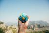 Person_holding_world_globe