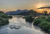 Sunset on the Mekong banks showing the river and hills beyond