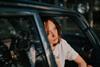 Depressed_woman_resting_in_car_during_golden_hour_near_forest