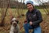 trainer in woods with dog