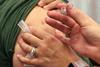 A_woman_receives_the_seasonal_influenza_vaccine_(flu_shot)._Credit-_NIAID_(31028518766)