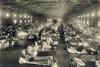Beds with patients in an emergency hospital in Camp Funston