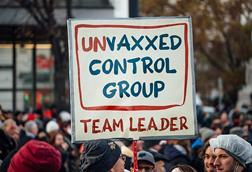 Protester_holding_sign_with_text__Unvaxxed_control_group._Team_leader_._Anti-vaccine_mandate_rally_in_Austria_(51692844747)