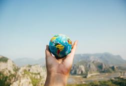 Person_holding_world_globe