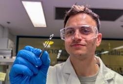 Low-Res_Dr Brendan Dyett with an experimental microneedle patch sample