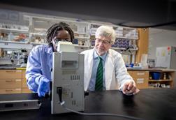 Low-Res_Sten Vermund (right) in the lab at the University of South Florida
