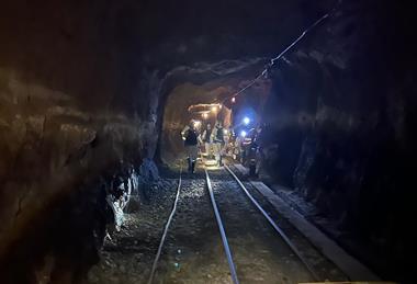 Team of geomicrobiologists walking to a sampling site at the end of an inactive tunnel in a South African gold mine Credit Emil Ruff