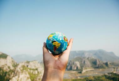 Person_holding_world_globe