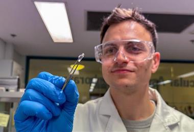 Low-Res_Dr Brendan Dyett with an experimental microneedle patch sample