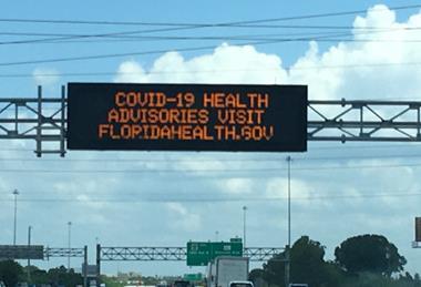 COVID-19_health_advisories_sign_on_Florida_Highway