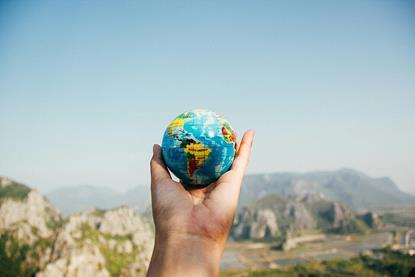 Person_holding_world_globe