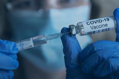 COVID-19_Vaccine_vial_and_syringe_-_US_Census