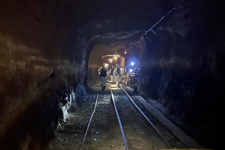 Team of geomicrobiologists walking to a sampling site at the end of an inactive tunnel in a South African gold mine Credit Emil Ruff