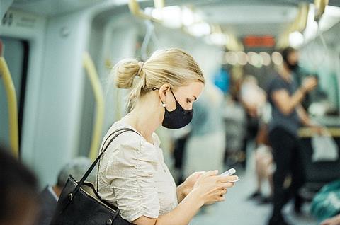 A_woman_wearing_a_protective_face_mask