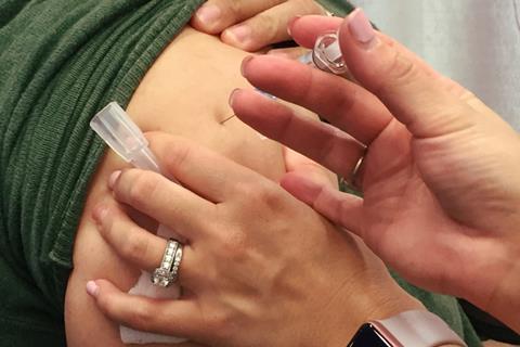 A_woman_receives_the_seasonal_influenza_vaccine_(flu_shot)._Credit-_NIAID_(31028518766)
