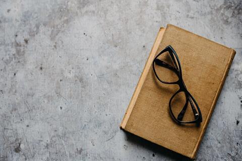 Old_glasses_on_old_book_from_above