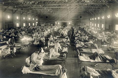 Beds with patients in an emergency hospital in Camp Funston